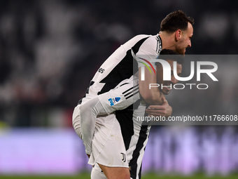 Juventus' Federico Gatti celebrates with Juventus' Danilo at the end of the Serie A match between Juventus and Torino FC at Allianz Stadium...