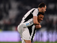 Juventus' Federico Gatti celebrates with Juventus' Danilo at the end of the Serie A match between Juventus and Torino FC at Allianz Stadium...