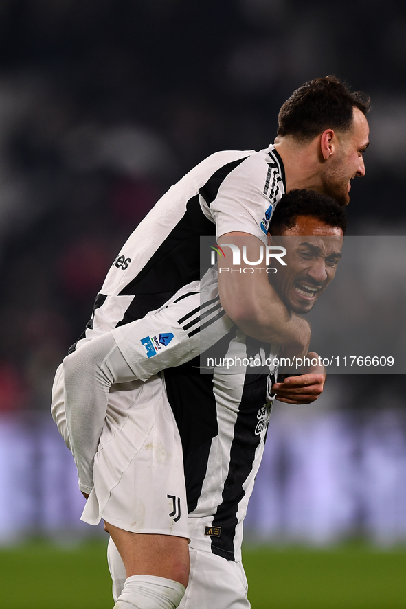 Juventus' Federico Gatti celebrates with Juventus' Danilo at the end of the Serie A match between Juventus and Torino FC at Allianz Stadium...