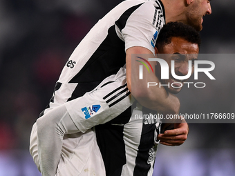 Juventus' Federico Gatti celebrates with Juventus' Danilo at the end of the Serie A match between Juventus and Torino FC at Allianz Stadium...