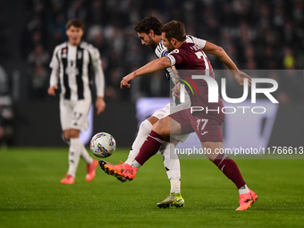 Manuel Locatelli of Juventus battles for the ball with Karol Linetty of Torino during the Serie A match between Juventus and Torino FC at Al...