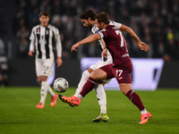 Manuel Locatelli of Juventus battles for the ball with Karol Linetty of Torino during the Serie A match between Juventus and Torino FC at Al...