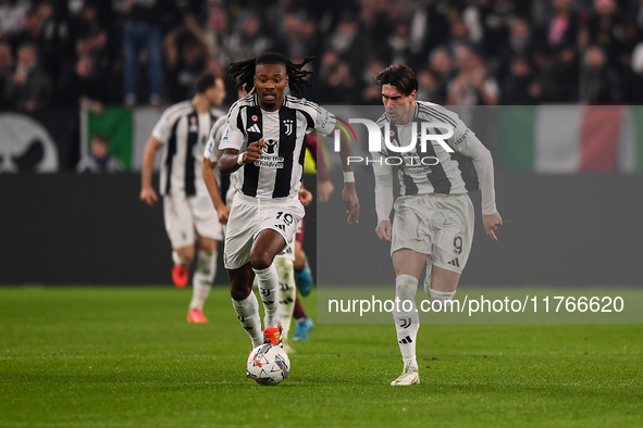 Khephren Thuram and Dusan Vlahovic of Juventus participate in the Serie A match between Juventus and Torino FC at Allianz Stadium in Turin,...