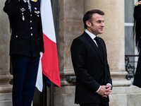 French President Emmanuel Macron receives British Prime Minister Keri Starmer at the Elysee Palace during celebrations marking the 106th ann...