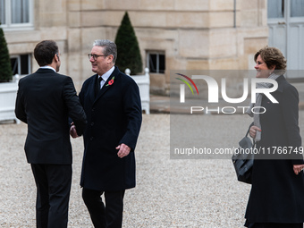 French President Emmanuel Macron receives British Prime Minister Keri Starmer at the Elysee Palace during celebrations marking the 106th ann...