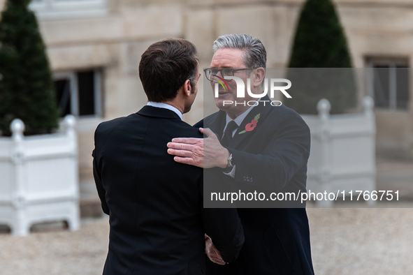 French President Emmanuel Macron receives British Prime Minister Keri Starmer at the Elysee Palace during celebrations marking the 106th ann...