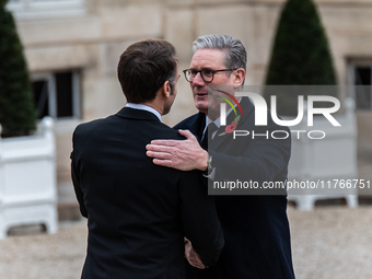 French President Emmanuel Macron receives British Prime Minister Keri Starmer at the Elysee Palace during celebrations marking the 106th ann...