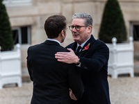 French President Emmanuel Macron receives British Prime Minister Keri Starmer at the Elysee Palace during celebrations marking the 106th ann...