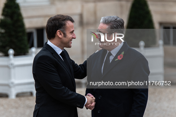 French President Emmanuel Macron receives British Prime Minister Keri Starmer at the Elysee Palace during celebrations marking the 106th ann...