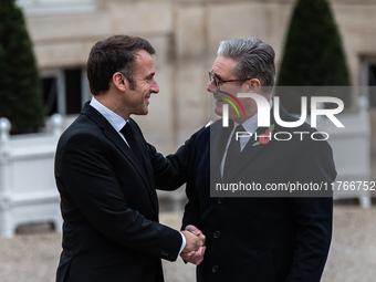 French President Emmanuel Macron receives British Prime Minister Keri Starmer at the Elysee Palace during celebrations marking the 106th ann...