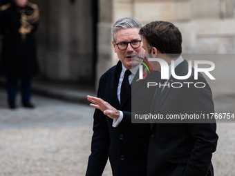 French President Emmanuel Macron receives British Prime Minister Keri Starmer at the Elysee Palace during celebrations marking the 106th ann...