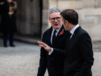 French President Emmanuel Macron receives British Prime Minister Keri Starmer at the Elysee Palace during celebrations marking the 106th ann...