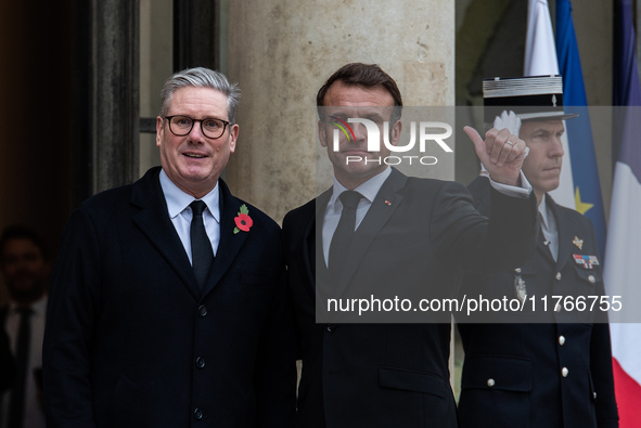 French President Emmanuel Macron receives British Prime Minister Keri Starmer at the Elysee Palace during celebrations marking the 106th ann...