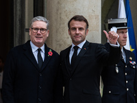 French President Emmanuel Macron receives British Prime Minister Keri Starmer at the Elysee Palace during celebrations marking the 106th ann...