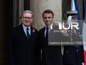 French President Emmanuel Macron receives British Prime Minister Keri Starmer at the Elysee Palace during celebrations marking the 106th ann...