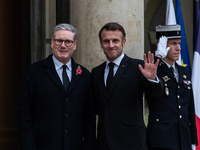 French President Emmanuel Macron receives British Prime Minister Keri Starmer at the Elysee Palace during celebrations marking the 106th ann...