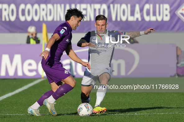 Riccardo Sottil of ACF Fiorentina and Tomas Suslov of Hellas Verona FC ,battle for the ball during the Italian Serie A football match betwee...