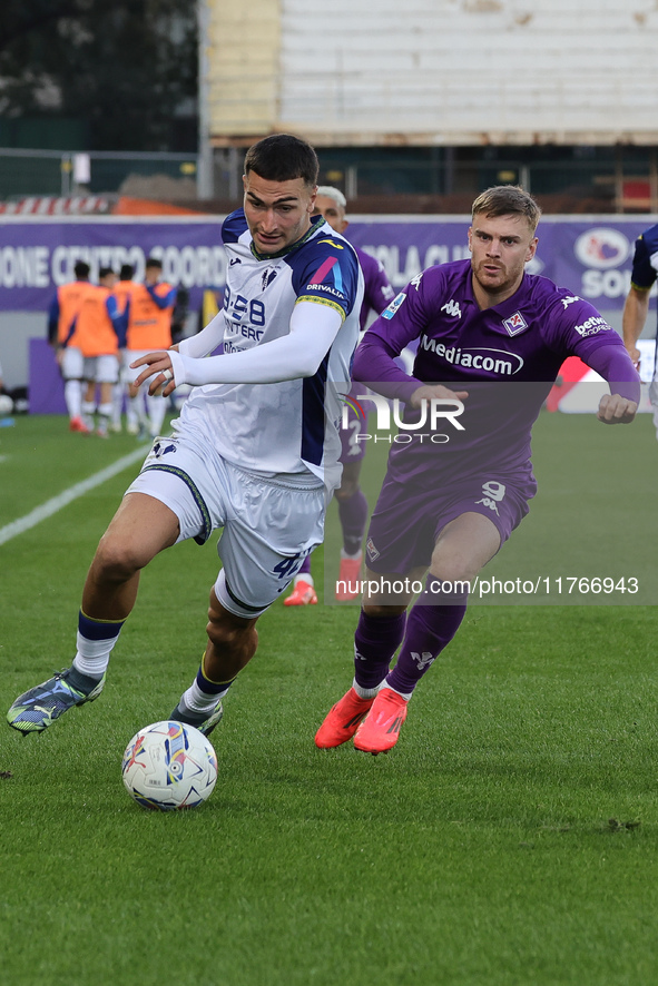 Lucas Beltran of ACF Fiorentina and Diego Coppola of Hellas Verona FC ,battle for the ball during the Italian Serie A football match between...