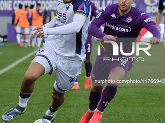 Lucas Beltran of ACF Fiorentina and Diego Coppola of Hellas Verona FC ,battle for the ball during the Italian Serie A football match between...