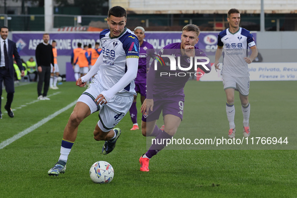 Lucas Beltran of ACF Fiorentina and Diego Coppola of Hellas Verona FC ,battle for the ball during the Italian Serie A football match between...