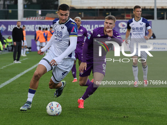 Lucas Beltran of ACF Fiorentina and Diego Coppola of Hellas Verona FC ,battle for the ball during the Italian Serie A football match between...