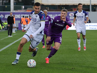 Lucas Beltran of ACF Fiorentina and Diego Coppola of Hellas Verona FC ,battle for the ball during the Italian Serie A football match between...