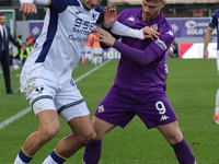 Lucas Beltran of ACF Fiorentina and Diego Coppola of Hellas Verona FC ,battle for the ball during the Italian Serie A football match between...