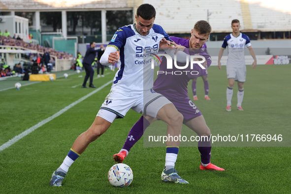 Lucas Beltran of ACF Fiorentina and Diego Coppola of Hellas Verona FC ,battle for the ball during the Italian Serie A football match between...