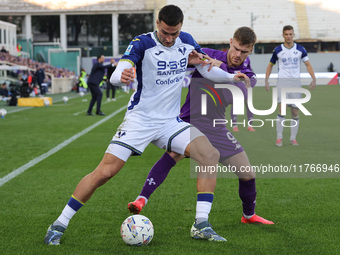 Lucas Beltran of ACF Fiorentina and Diego Coppola of Hellas Verona FC ,battle for the ball during the Italian Serie A football match between...