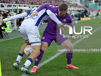 Lucas Beltran of ACF Fiorentina and Diego Coppola of Hellas Verona FC ,battle for the ball during the Italian Serie A football match between...