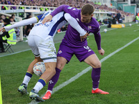 Lucas Beltran of ACF Fiorentina and Diego Coppola of Hellas Verona FC ,battle for the ball during the Italian Serie A football match between...