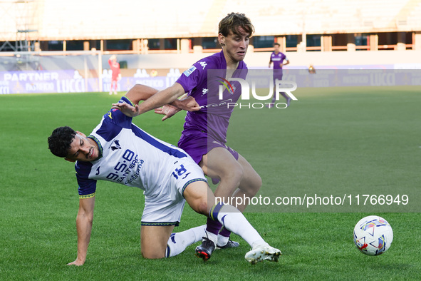 Edoardo Bove of ACF Fiorentina and Abdou Harroui of Hellas Verona FC ,battle for the ball during the Italian Serie A football match between...