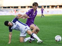 Edoardo Bove of ACF Fiorentina and Abdou Harroui of Hellas Verona FC ,battle for the ball during the Italian Serie A football match between...