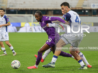 Christian Kouame of ACF Fiorentina and Diego Coppola of Hellas Verona FC ,battle for the ball during the Italian Serie A football match betw...