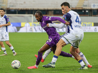 Christian Kouame of ACF Fiorentina and Diego Coppola of Hellas Verona FC ,battle for the ball during the Italian Serie A football match betw...