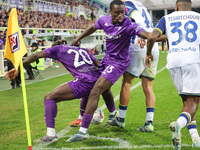 Moise Kean and Michael Kayode of ACF Fiorentina and Diego Coppola and Jackson Tchatchouaof Hellas Verona FC ,battle for the ball during the...