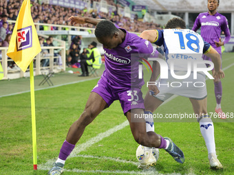 Michael Kayode of ACF Fiorentina and Abdou Harroui of Hellas Verona FC ,battle for the ball during the Italian Serie A football match betwee...