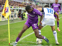 Michael Kayode of ACF Fiorentina and Abdou Harroui of Hellas Verona FC ,battle for the ball during the Italian Serie A football match betwee...