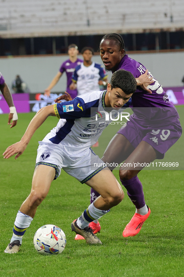 Christian Kouame of ACF Fiorentina and Reda Belahyane of Hellas Verona FC ,battle for the ball during the Italian Serie A football match bet...