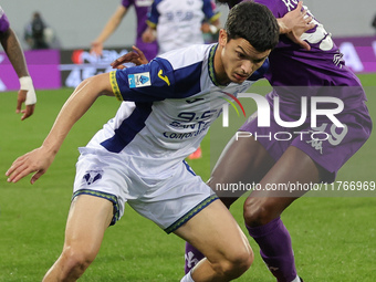 Christian Kouame of ACF Fiorentina and Reda Belahyane of Hellas Verona FC ,battle for the ball during the Italian Serie A football match bet...