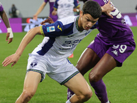 Christian Kouame of ACF Fiorentina and Reda Belahyane of Hellas Verona FC ,battle for the ball during the Italian Serie A football match bet...