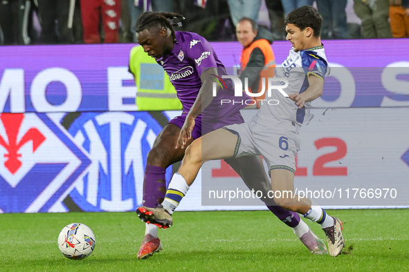 Moise Kean of ACF Fiorentina and Reda Belahyane of Hellas Verona FC ,battle for the ball during the Italian Serie A football match between A...