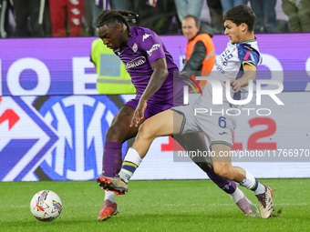 Moise Kean of ACF Fiorentina and Reda Belahyane of Hellas Verona FC ,battle for the ball during the Italian Serie A football match between A...