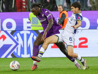 Moise Kean of ACF Fiorentina and Reda Belahyane of Hellas Verona FC ,battle for the ball during the Italian Serie A football match between A...