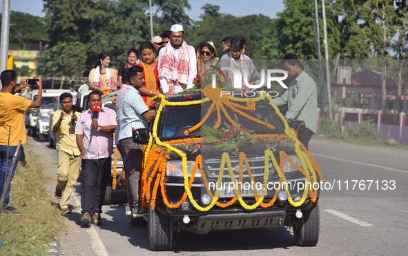 Congress candidate from the Samaguri constituency, Tanzil Hussain, participates in a roadshow during an election campaign rally ahead of the...