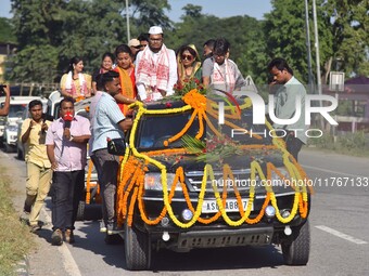 Congress candidate from the Samaguri constituency, Tanzil Hussain, participates in a roadshow during an election campaign rally ahead of the...