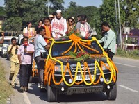 Congress candidate from the Samaguri constituency, Tanzil Hussain, participates in a roadshow during an election campaign rally ahead of the...