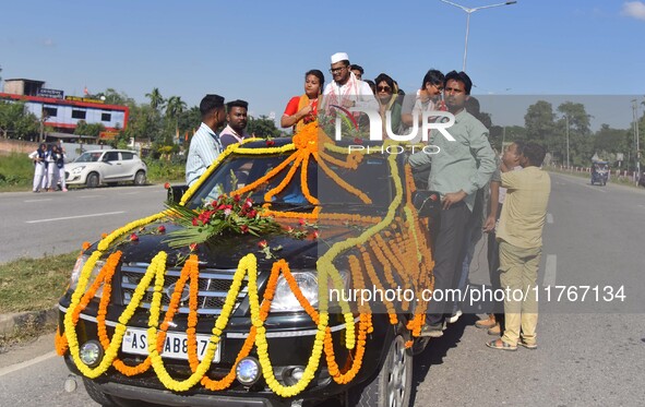 Congress candidate from the Samaguri constituency, Tanzil Hussain, participates in a roadshow during an election campaign rally ahead of the...