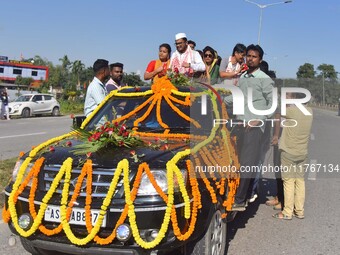 Congress candidate from the Samaguri constituency, Tanzil Hussain, participates in a roadshow during an election campaign rally ahead of the...