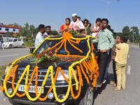 Congress candidate from the Samaguri constituency, Tanzil Hussain, participates in a roadshow during an election campaign rally ahead of the...